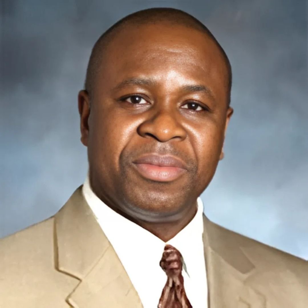 Dr Mike Koku