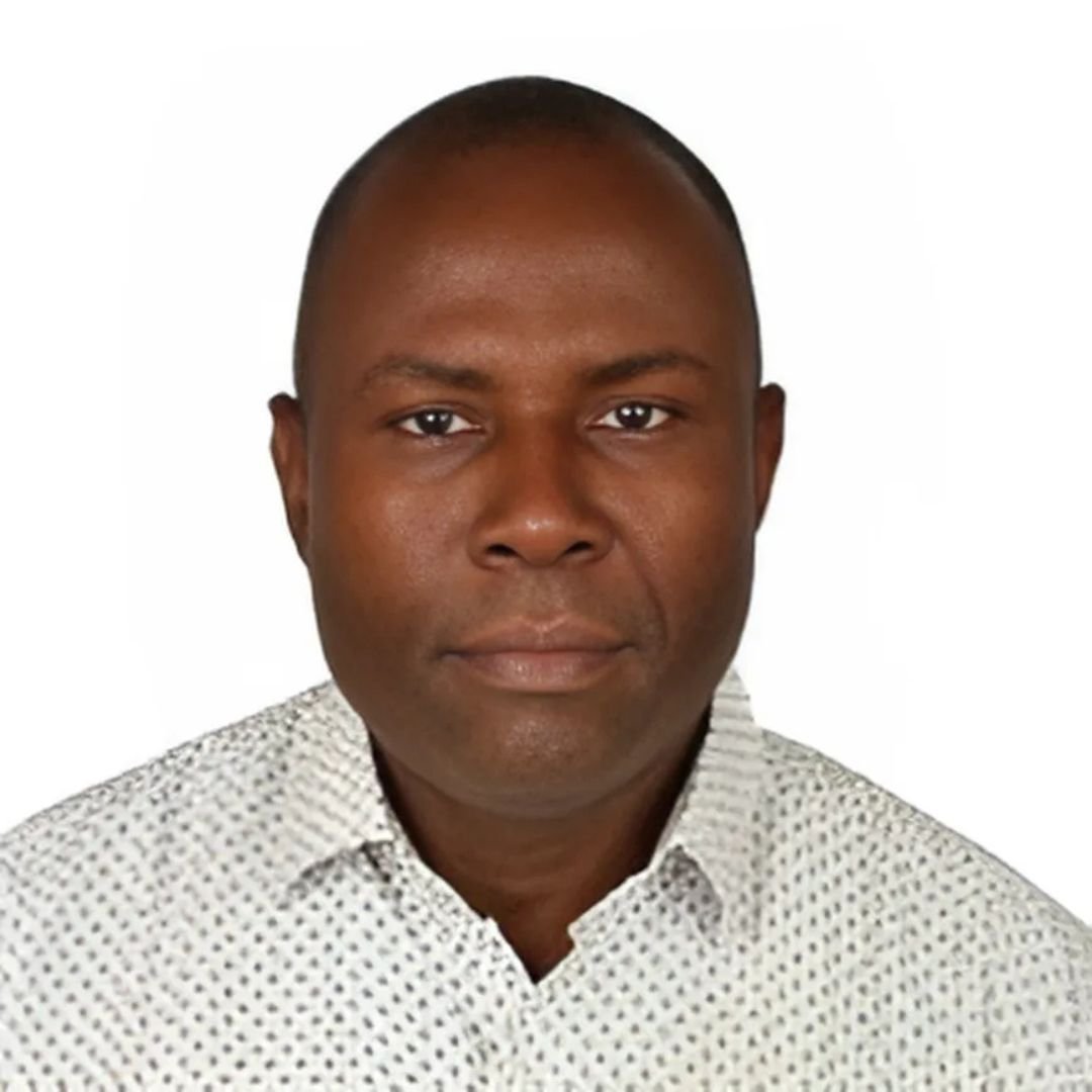 Dr Mike Koku