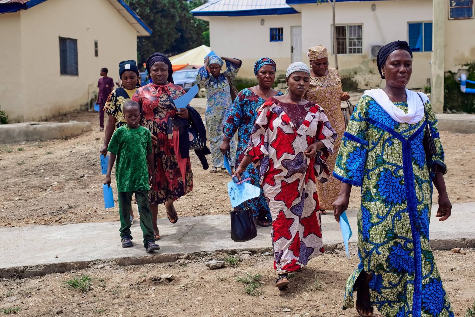 People walking outdoors at the outreach venue.