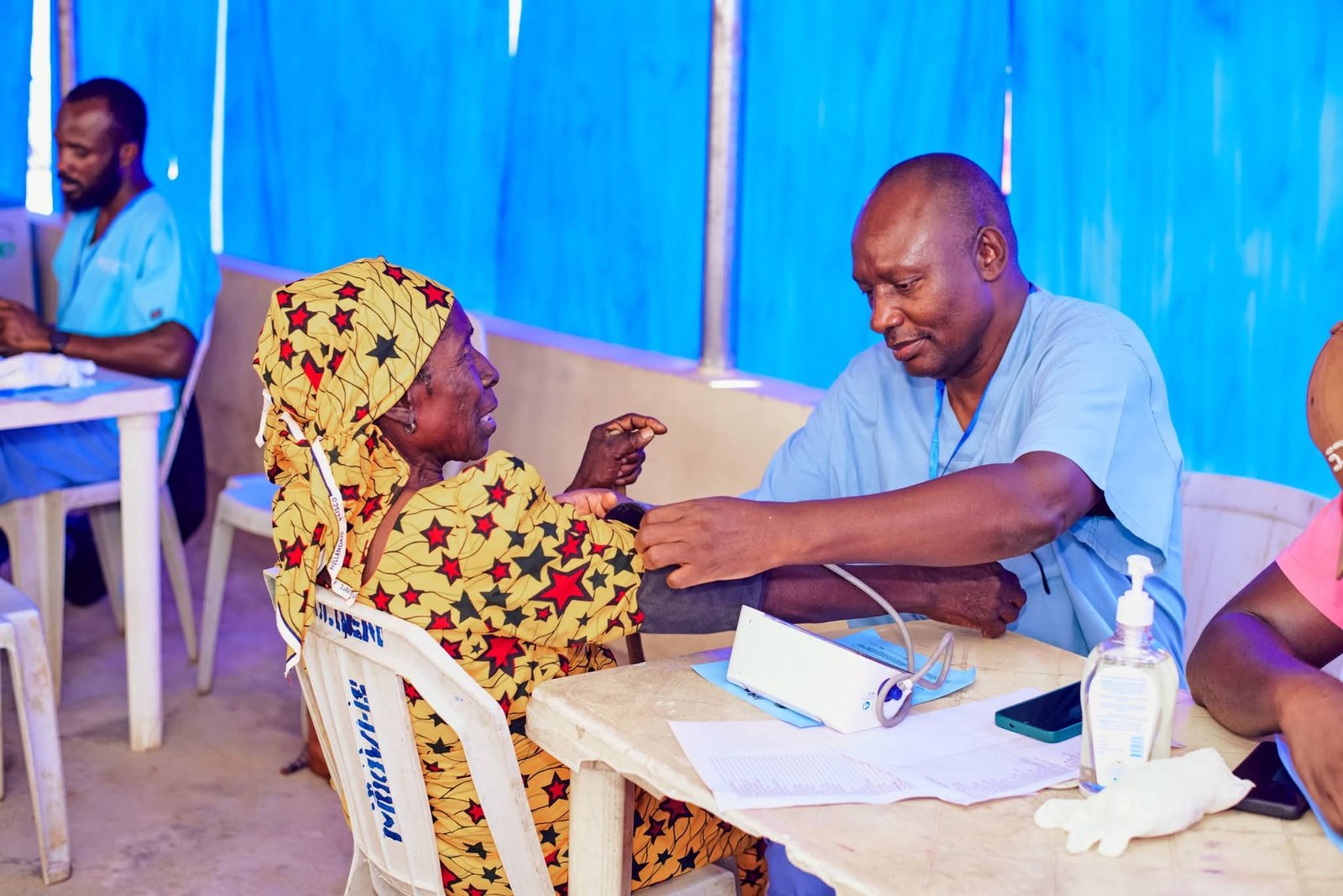 A clinician consults with a participant during the medical outreach.