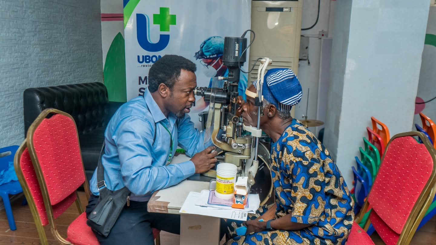 A clinician examines a patient’s eyes during the UBOMI outreach in Ibadan.
