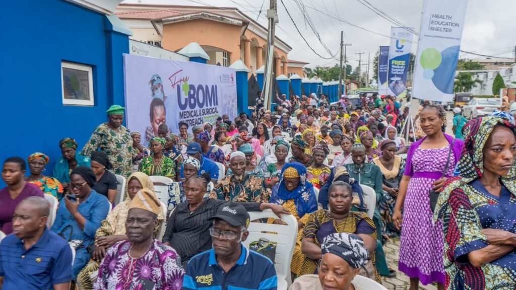 Community members gather beneath UBOMI 2026 outreach banners in Ibadan.
